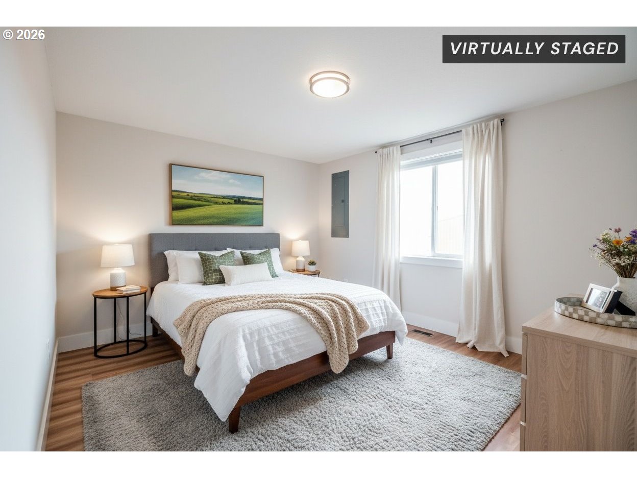 10471 Wagon Road Northeast Mount Angel, OR 97362 - Photo 21 of 48 a spacious bedroom with a bed and a window