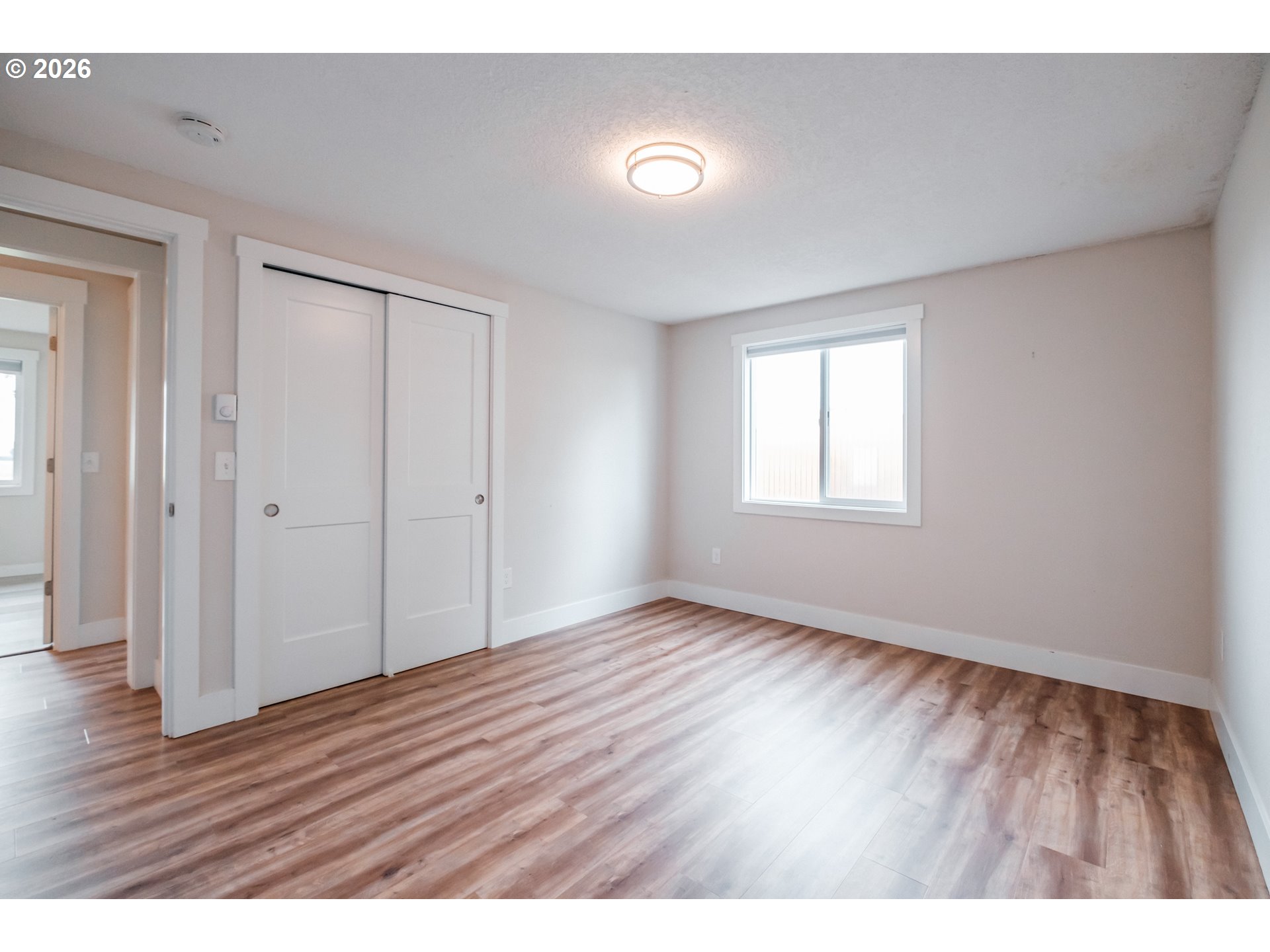 10471 Wagon Road Northeast Mount Angel, OR 97362 - Photo 32 of 48 a view of an empty room with window and wooden floor