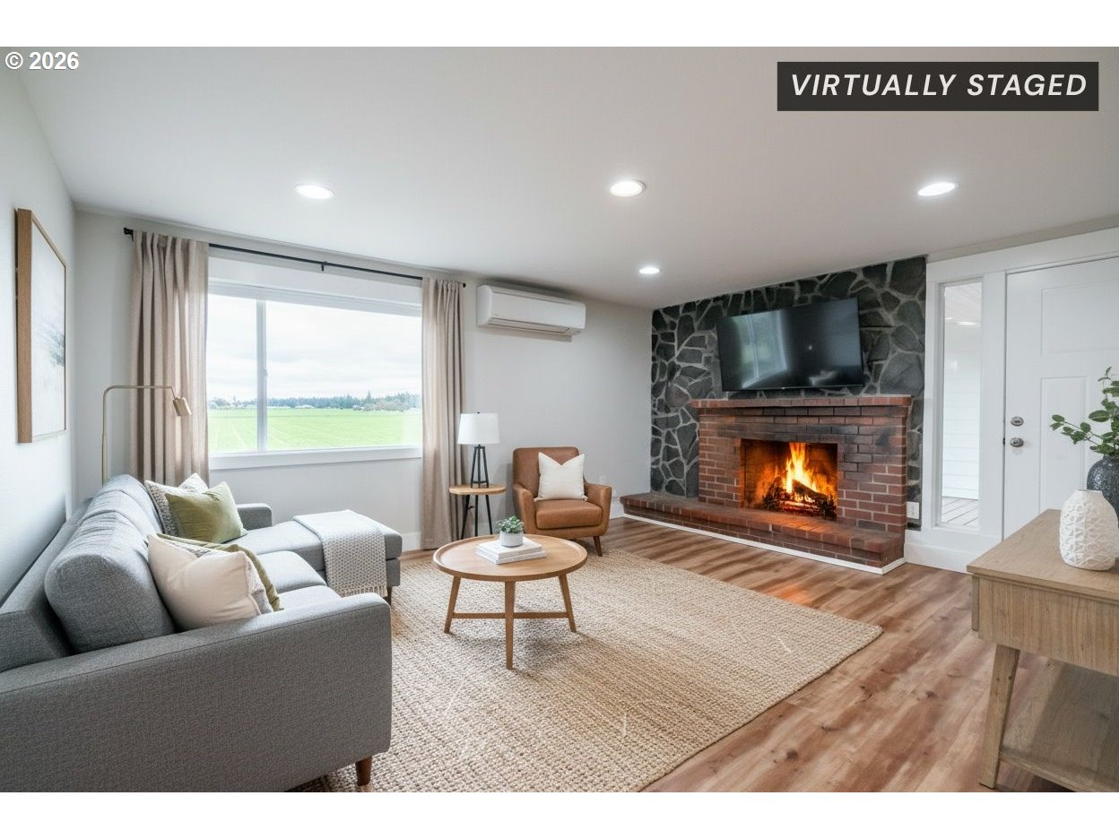 10471 Wagon Road Northeast Mount Angel, OR 97362 - Photo 4 of 48 a living room with furniture and a fireplace
