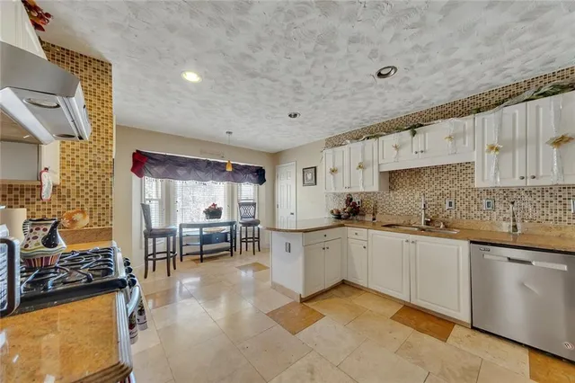 a kitchen with counter space cabinets and appliances