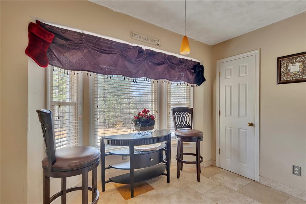 6401 Fox Run Winston, GA 30187 - Photo 19 of 48 a view of a dining room with furniture and a window