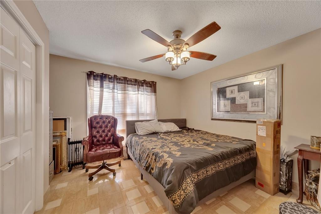 6401 Fox Run Winston, GA 30187 - Photo 26 of 48 a bedroom with a bed and a chandelier