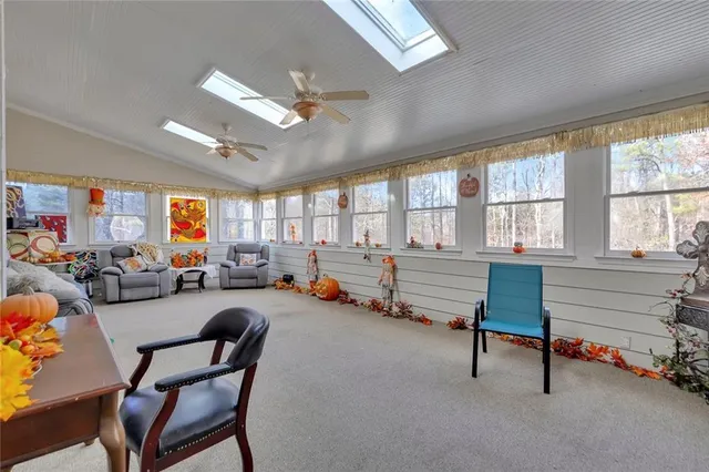 a bedroom with furniture and a window