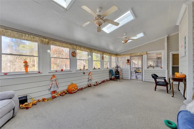 a room with gym equipment and a large window