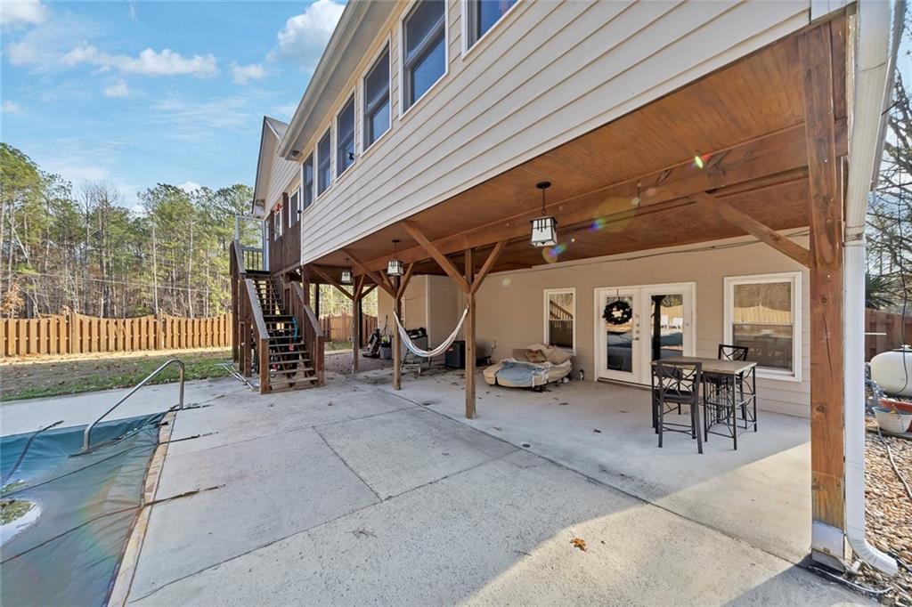 6401 Fox Run Winston, GA 30187 - Photo 46 of 48 a view of a patio with table and chairs and potted plants