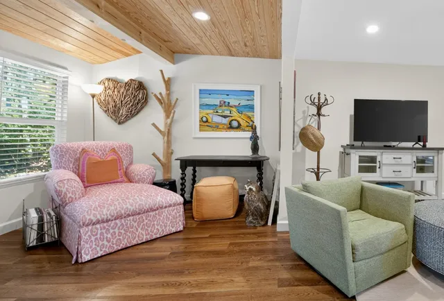 a bedroom with furniture and a window