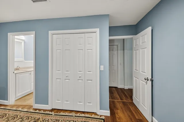 a bathroom with a granite countertop sink mirror and shower