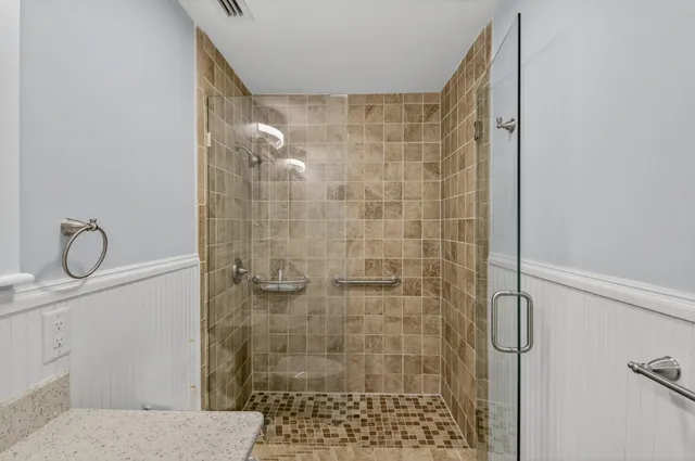 a bedroom with a bed and a table