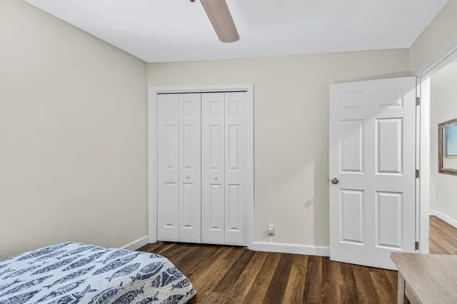 a bedroom with a bed and a lamp