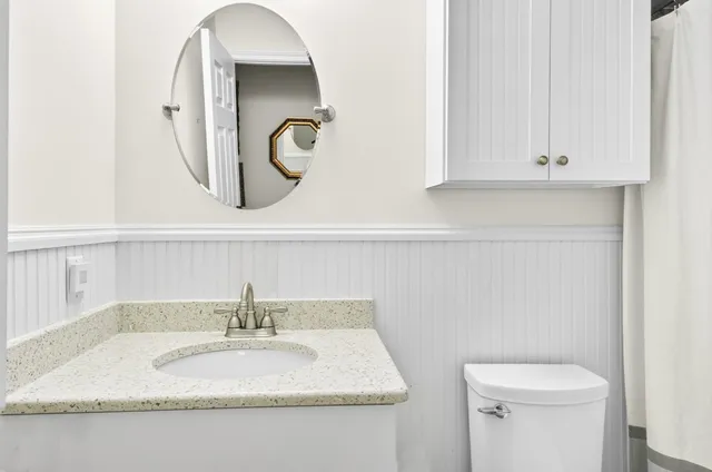 a view of a yard with large trees