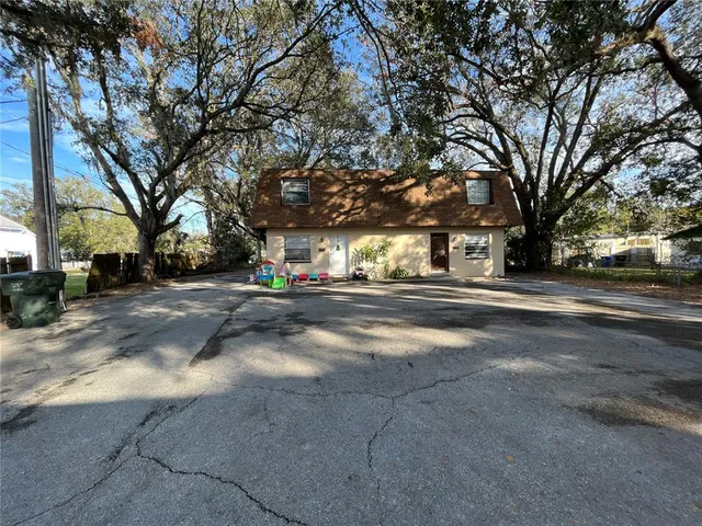 a view of road with with large trees