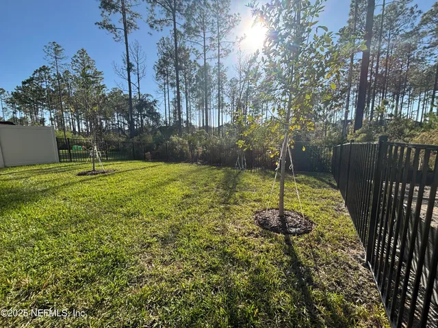 a swimming pool with wooden fence