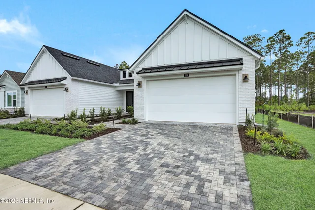a view of a swimming pool with outdoor seating