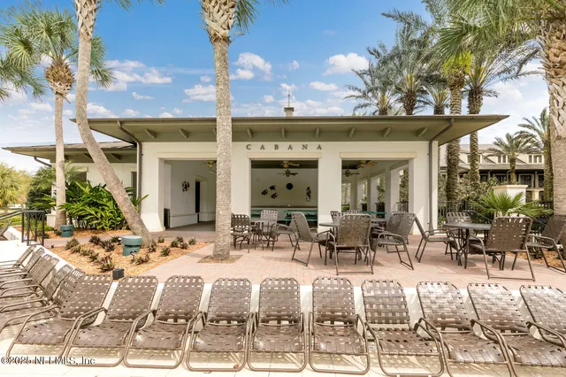 a swimming pool with outdoor seating