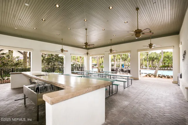 a view of a swimming pool with a patio