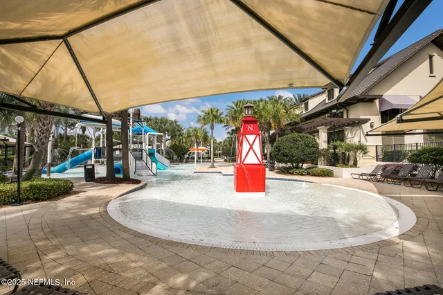 a view of a swimming pool with outdoor seating