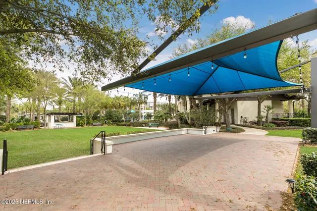 a view of a swimming pool with two chairs