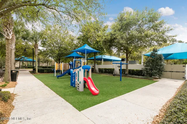 a view of a patio with swimming pool table and chairs