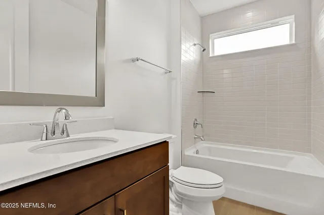 a bathroom with a sink a toilet and a bathtub