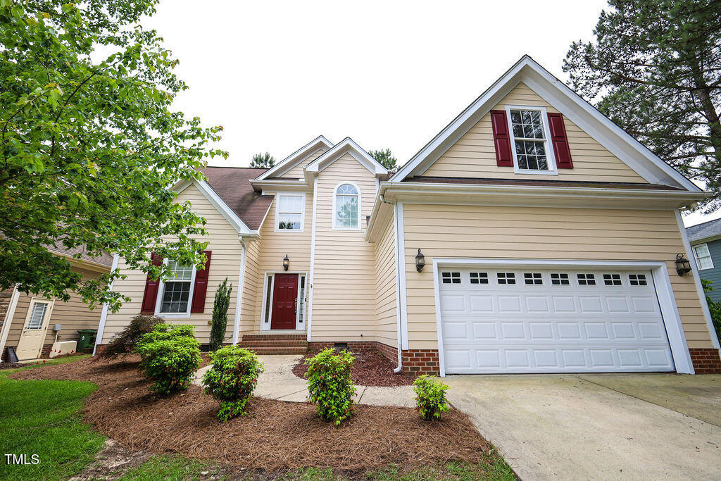 10 London Way Spring Lake, NC 28390 - Photo 2 of 26 a front view of a house with a yard and garage