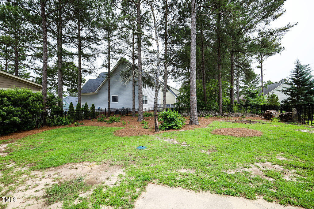 10 London Way Spring Lake, NC 28390 - Photo 25 of 26 a front view of a house with yard and green space
