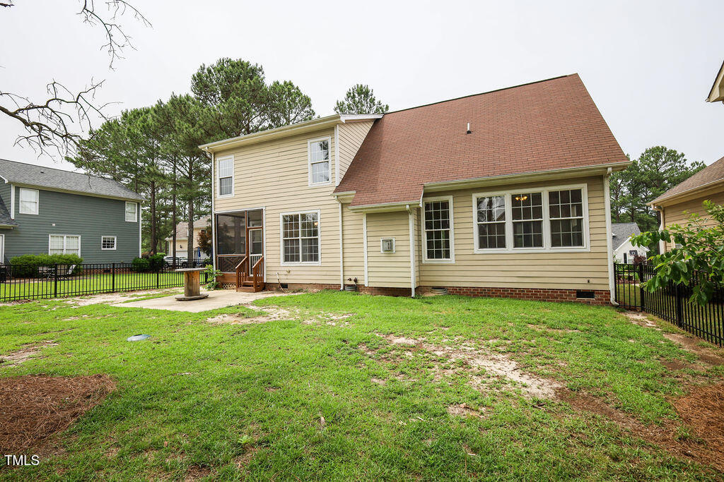 10 London Way Spring Lake, NC 28390 - Photo 26 of 26 a backyard of a house with table and chairs