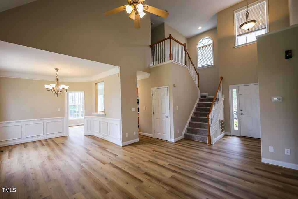 10 London Way Spring Lake, NC 28390 - Photo 6 of 26 wooden floor in an empty room with a gallery