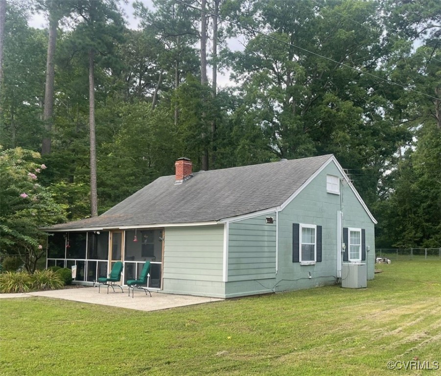 328 Cow Shed Road Lancaster, VA 22503 - Photo 1 of 27 a front view of a house with a yard patio and green space