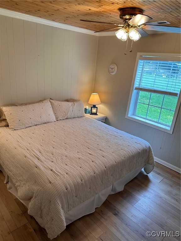 328 Cow Shed Road Lancaster, VA 22503 - Photo 15 of 27 a bedroom with a bed and a window