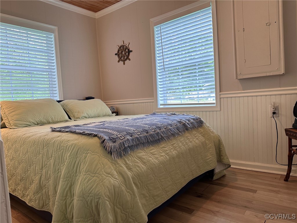 328 Cow Shed Road Lancaster, VA 22503 - Photo 19 of 27 a bedroom with a bed and a window