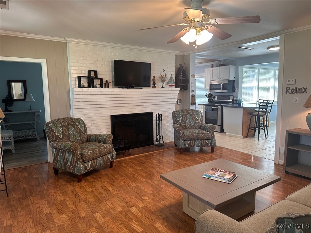 328 Cow Shed Road Lancaster, VA 22503 - Photo 8 of 27 a living room with furniture and a fireplace