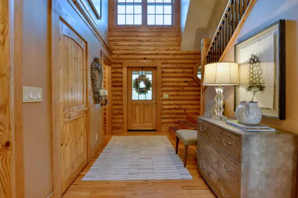 a view of balcony with wooden floor and fence