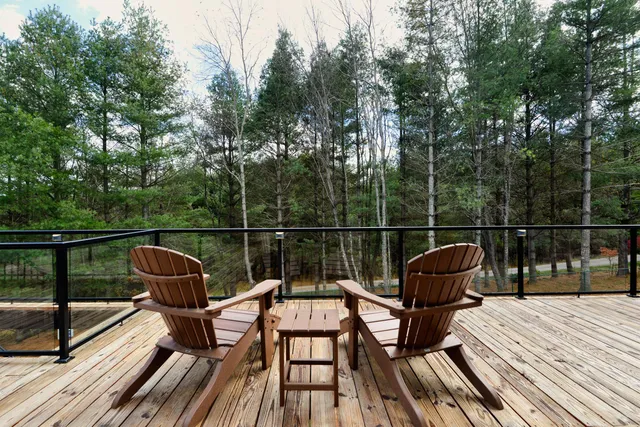 a kitchen with stainless steel appliances granite countertop a stove a sink dishwasher and microwave oven with cabinets