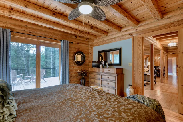 a view of a room with a table and chairs