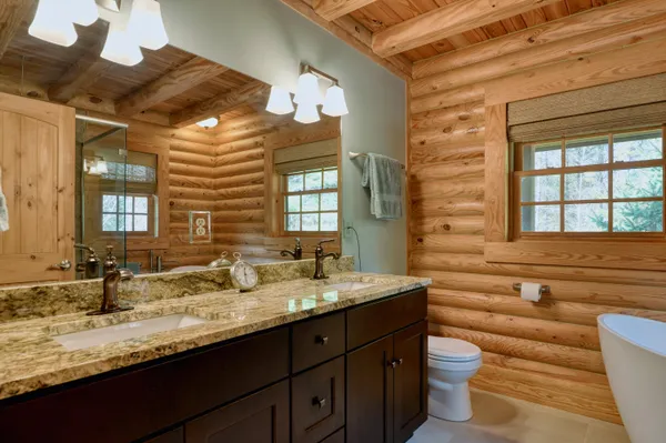 a bathroom with a sink a mirror and a shower
