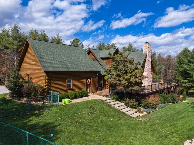 a view of entryway with wooden floor and stairs