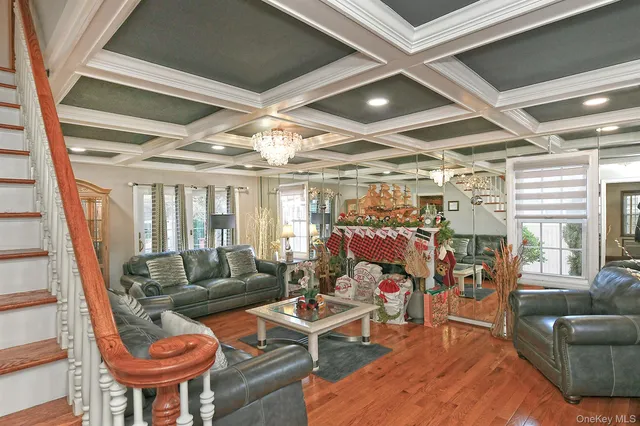 a living room with lots of furniture and a chandelier