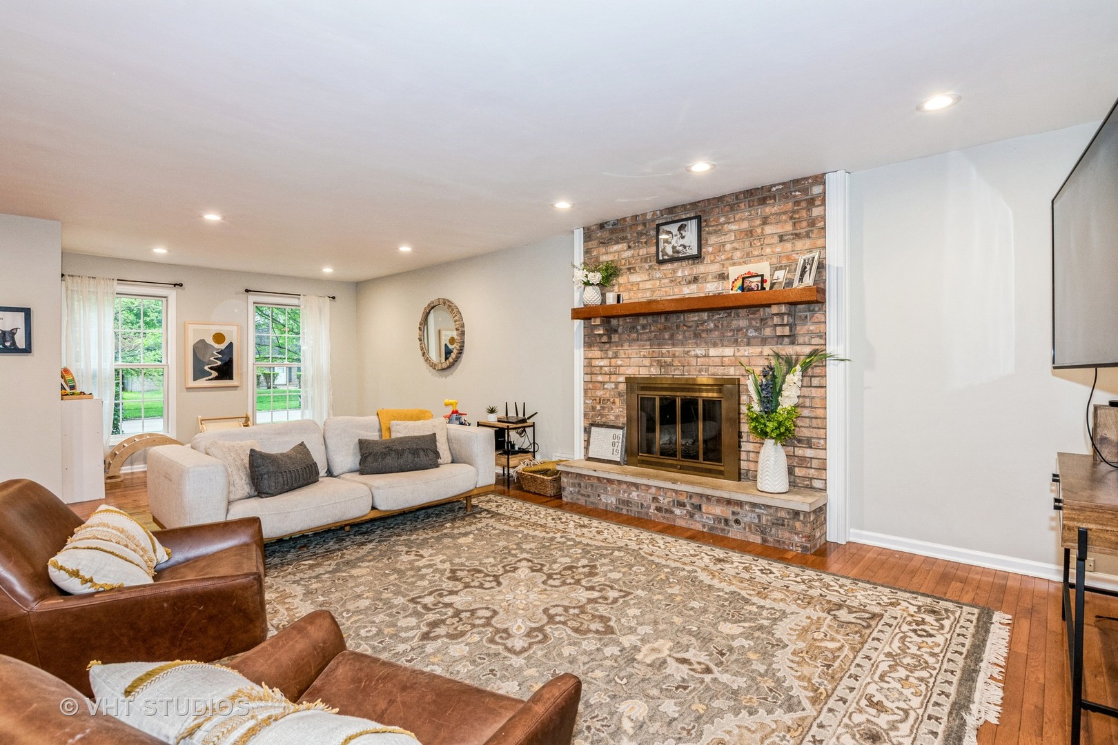 1057 Ponca Drive Batavia, IL 60510 - Photo 3 of 23 a living room with furniture and a fireplace