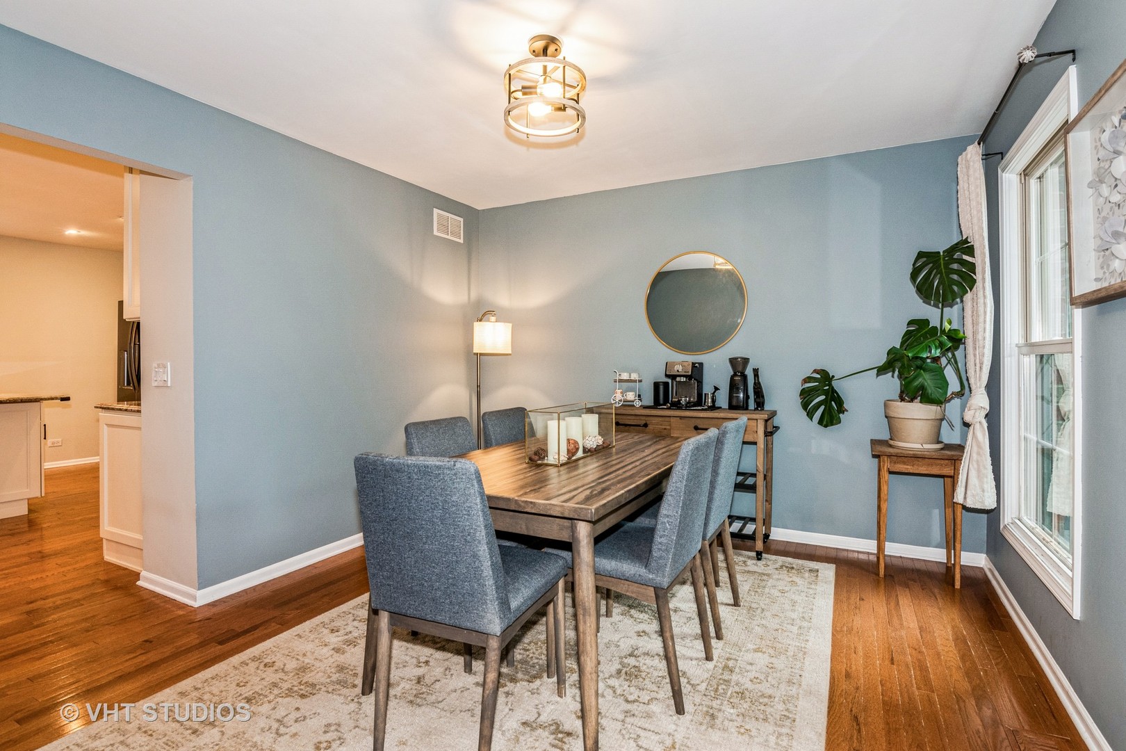 1057 Ponca Drive Batavia, IL 60510 - Photo 8 of 23 a dining room with furniture and wooden floor