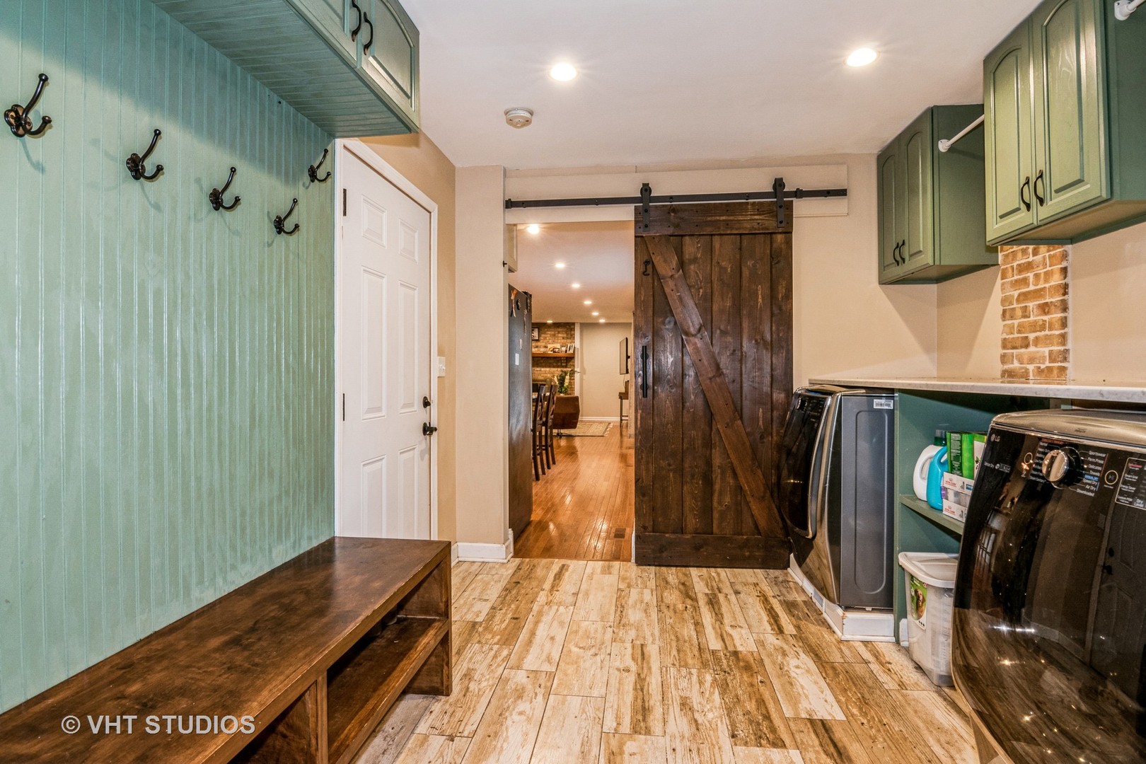 1057 Ponca Drive Batavia, IL 60510 - Photo 9 of 23 a view of a hallway with wooden floor and staircase
