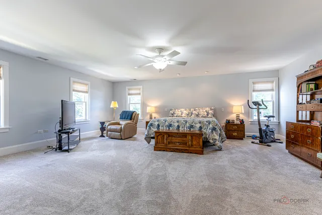 a bedroom with furniture and a chandelier