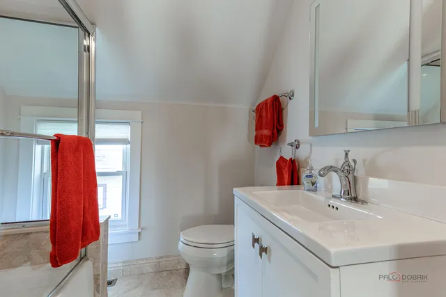 a bathroom with a sink toilet and vanity