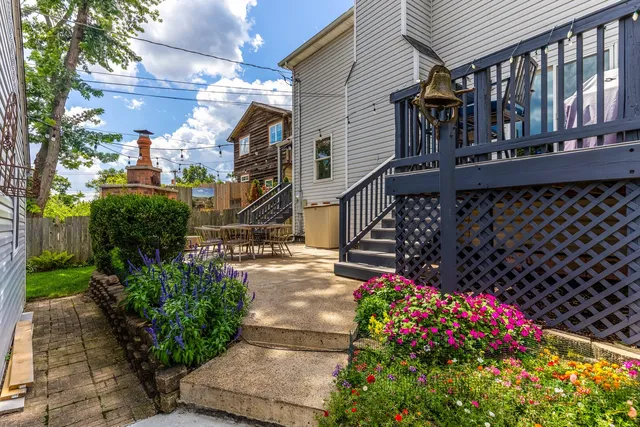 a view of a house with a flower garden