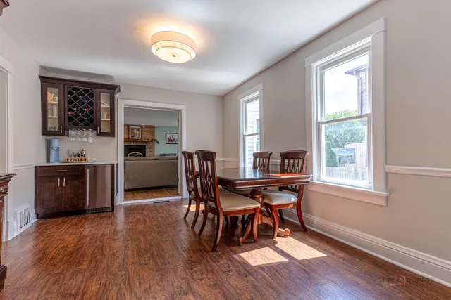 a view of a dining room with furniture and a window