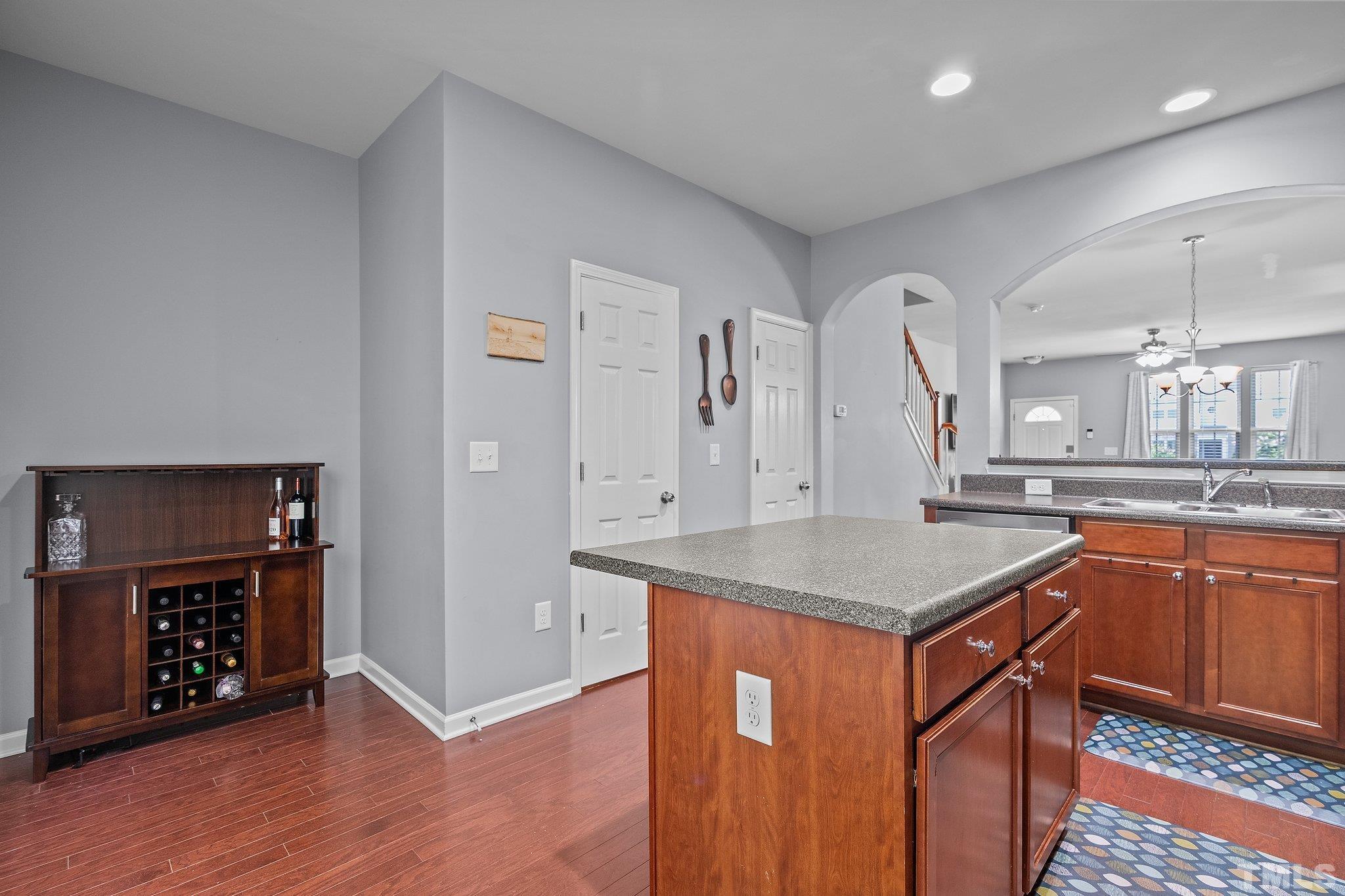 8564 Quarton Drive Raleigh, NC 27616 - Photo 13 of 28 a kitchen with stainless steel appliances granite countertop a sink and a stove
