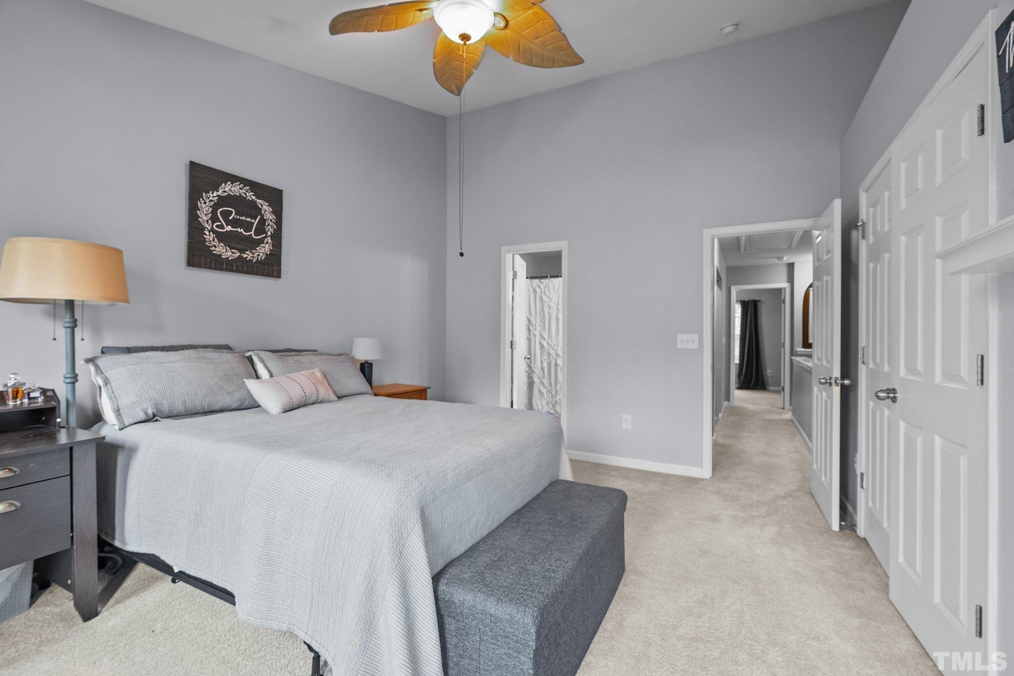 8564 Quarton Drive Raleigh, NC 27616 - Photo 14 of 28 a bedroom with a bed and a lamp