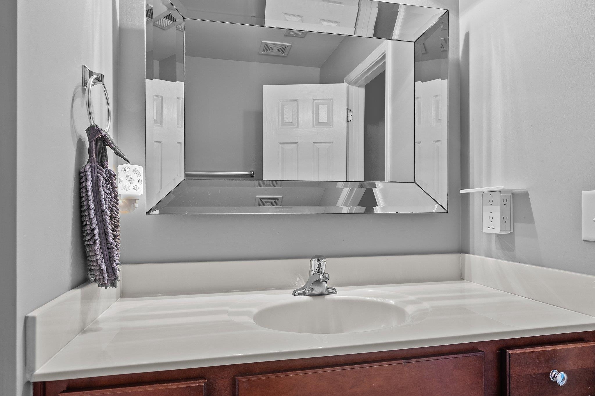 8564 Quarton Drive Raleigh, NC 27616 - Photo 18 of 28 a bathroom with a sink and a mirror