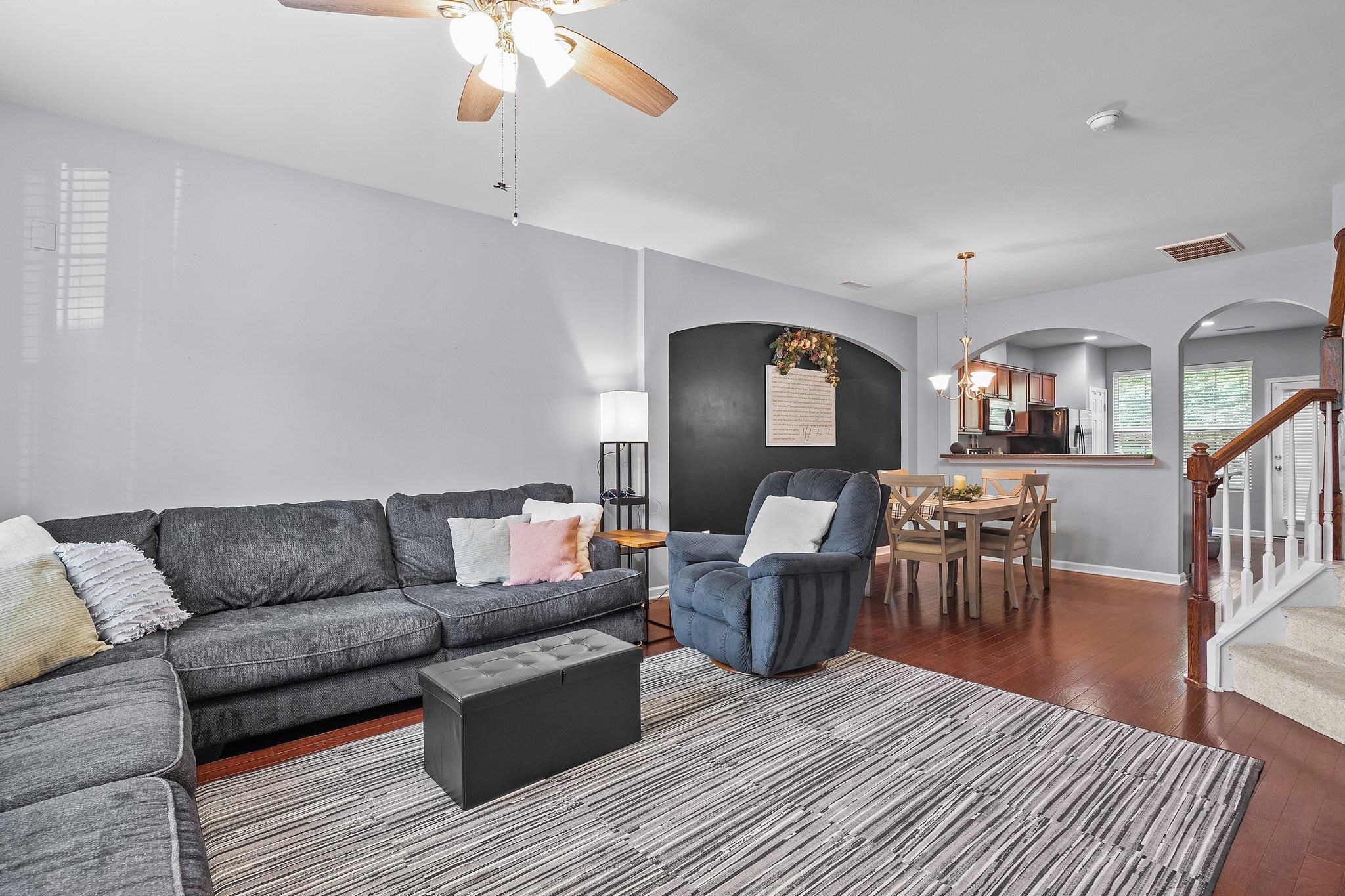 8564 Quarton Drive Raleigh, NC 27616 - Photo 6 of 28 a living room with furniture and a dining table