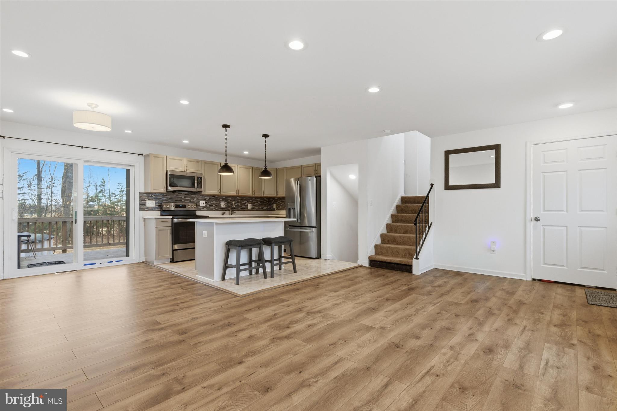 7428 Hawkins Drive Hanover, MD 21076 - Photo 14 of 44 a view of kitchen with furniture and wooden floor