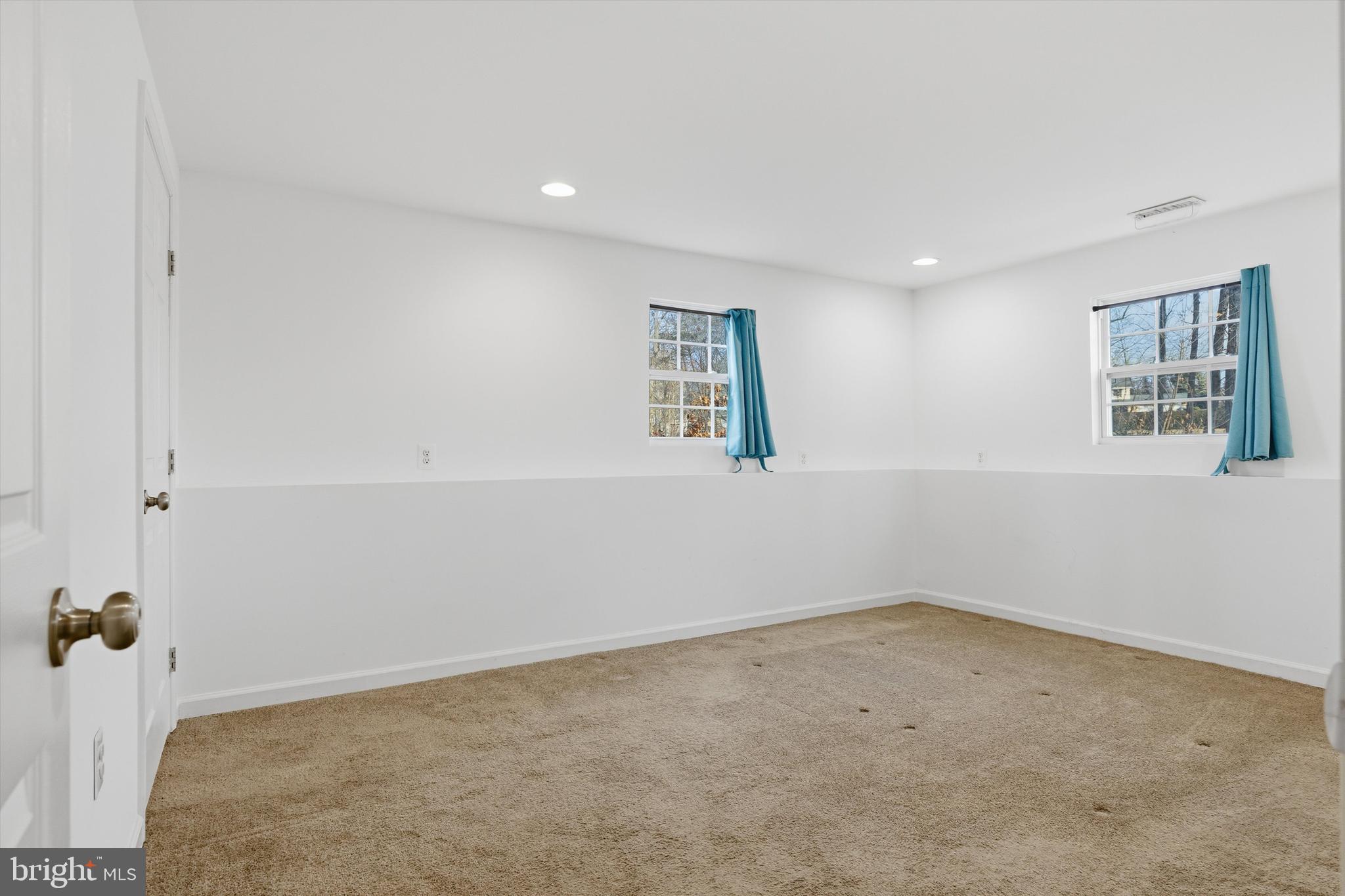 7428 Hawkins Drive Hanover, MD 21076 - Photo 18 of 44 an empty room with windows